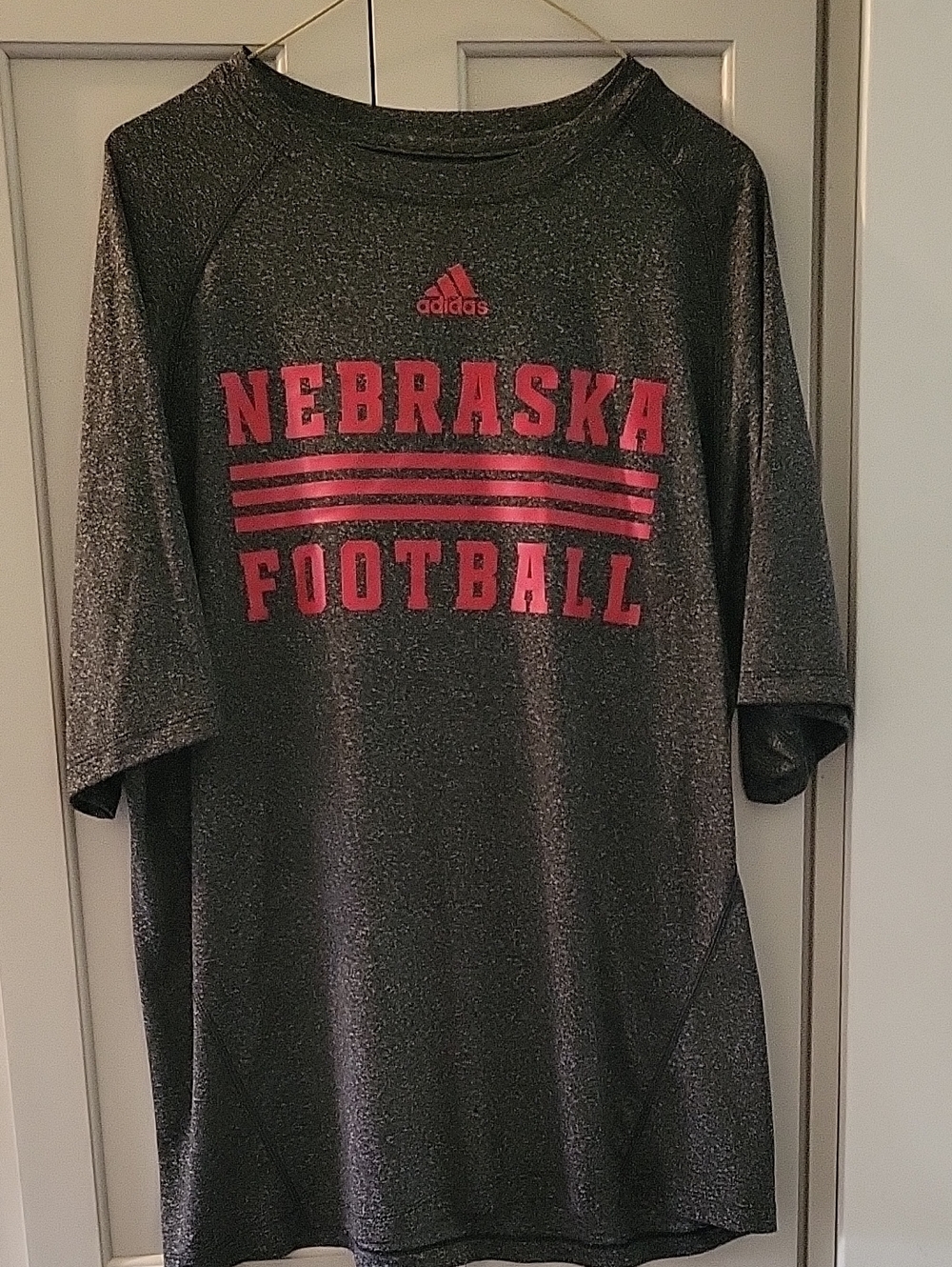 adidas Mottled Black Nebraska Football tee with Red Lettering